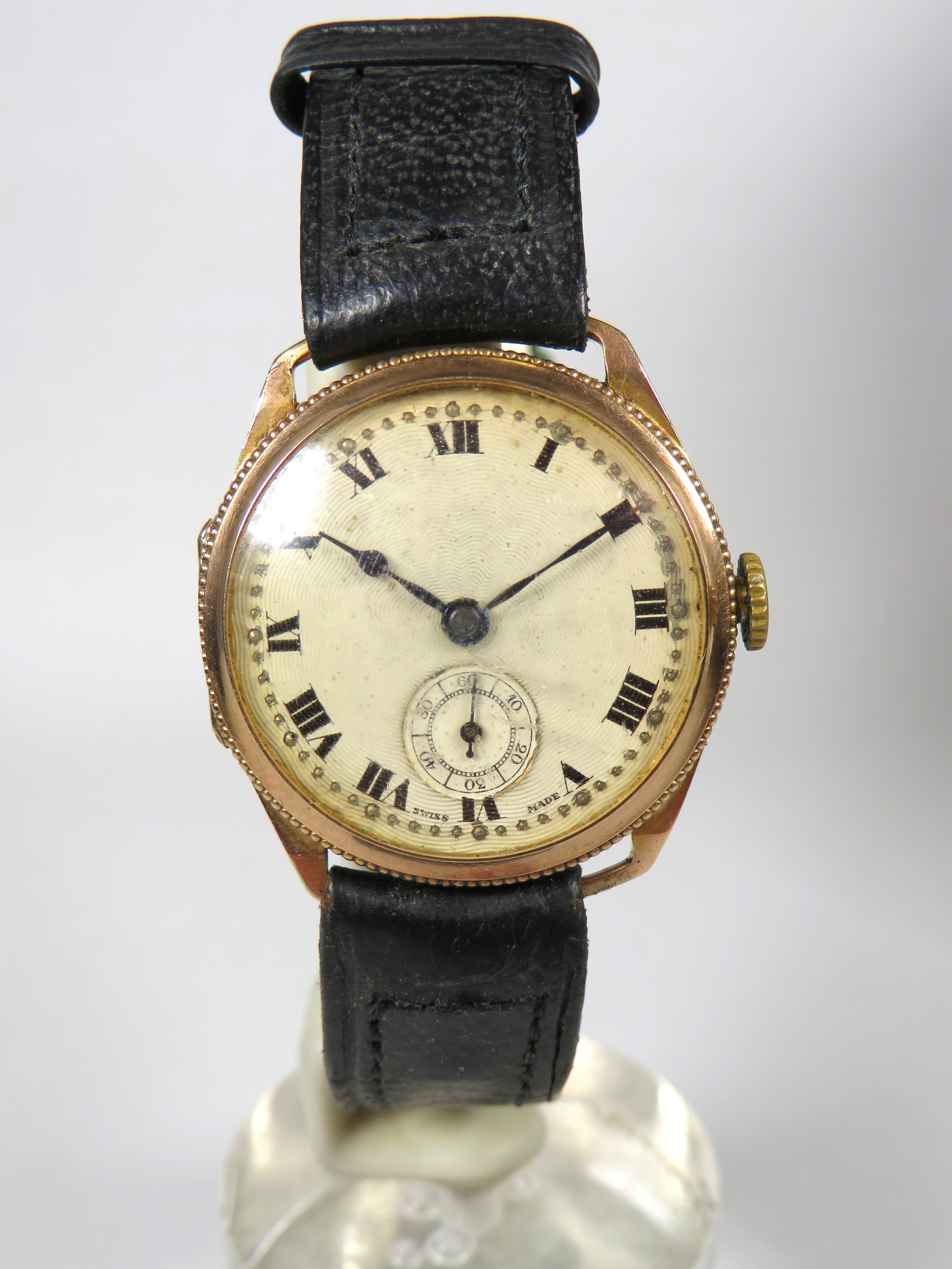 Swiss made 15 Jewel watch with leather strap, Subsidary dial. 9ct Case & Bezel.  Non runner for spar