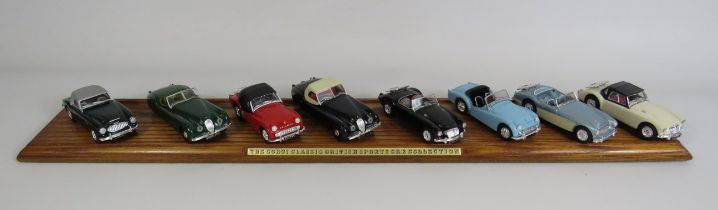 The Corgi classic sports car collection 8 diecast sports cars in boxes and wooden display plinth.