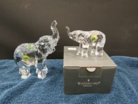 Large and small waterford crystal elephant figurines. One with box.