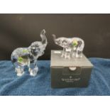 Large and small waterford crystal elephant figurines. One with box.