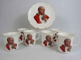 A Plate and Six cups to commemorate The Pope John Paul II visit to uk in 1982 by Royal Albert.