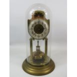 Large German Made Brass Based Anniversary clock under Glass dome which measures approx 14 inches