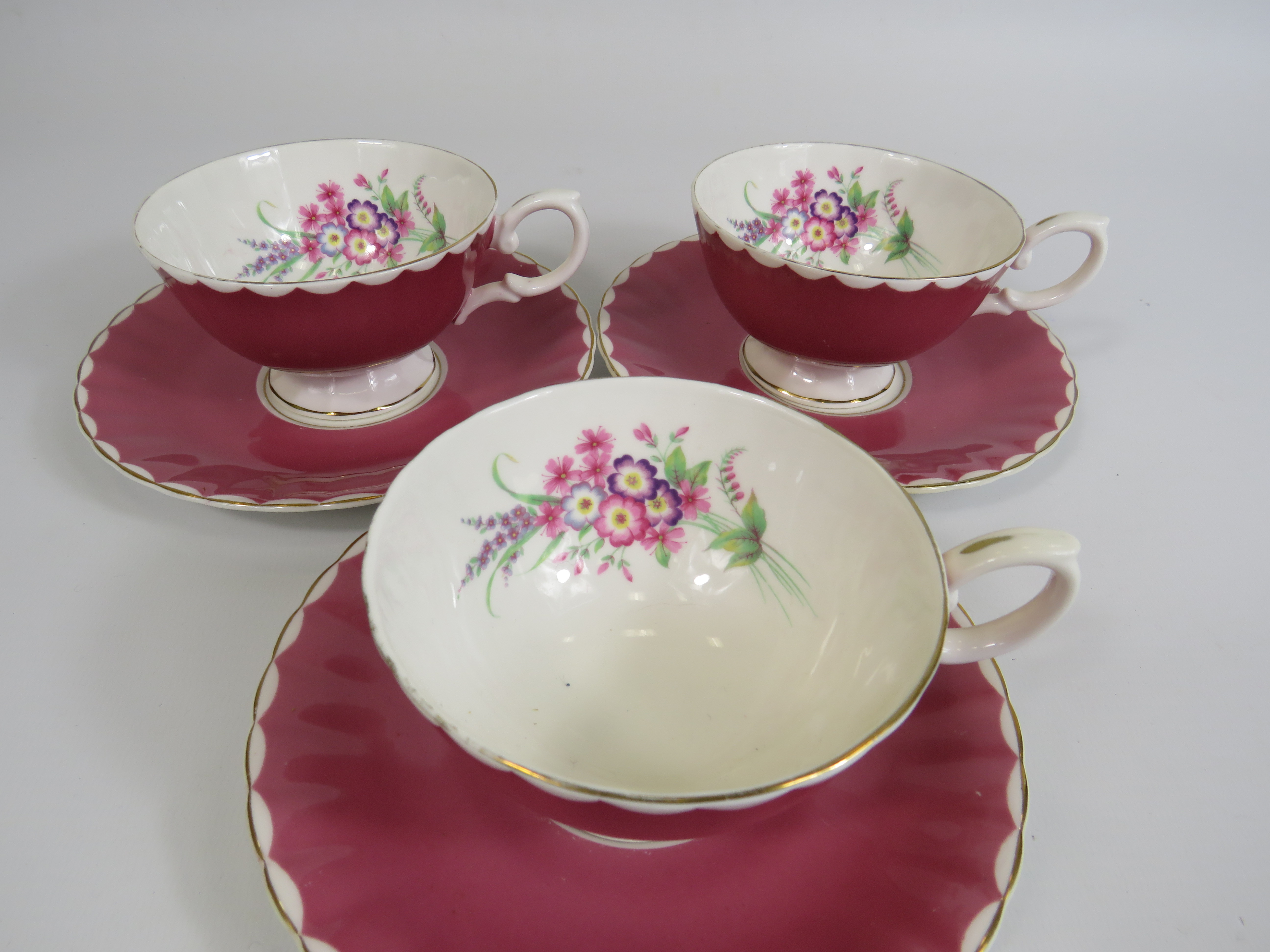 3 Susie Cooper pink cabinet cups and saucers with floral decoration to the bowl. - Image 2 of 4