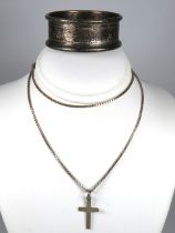 Silver Crucifix hung on a Silver Cage link chain together with a Hallmarked Silver Napkin Ring. To