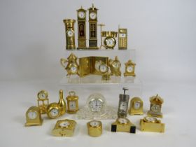 Large selection of miniature brass novelty clocks etc.