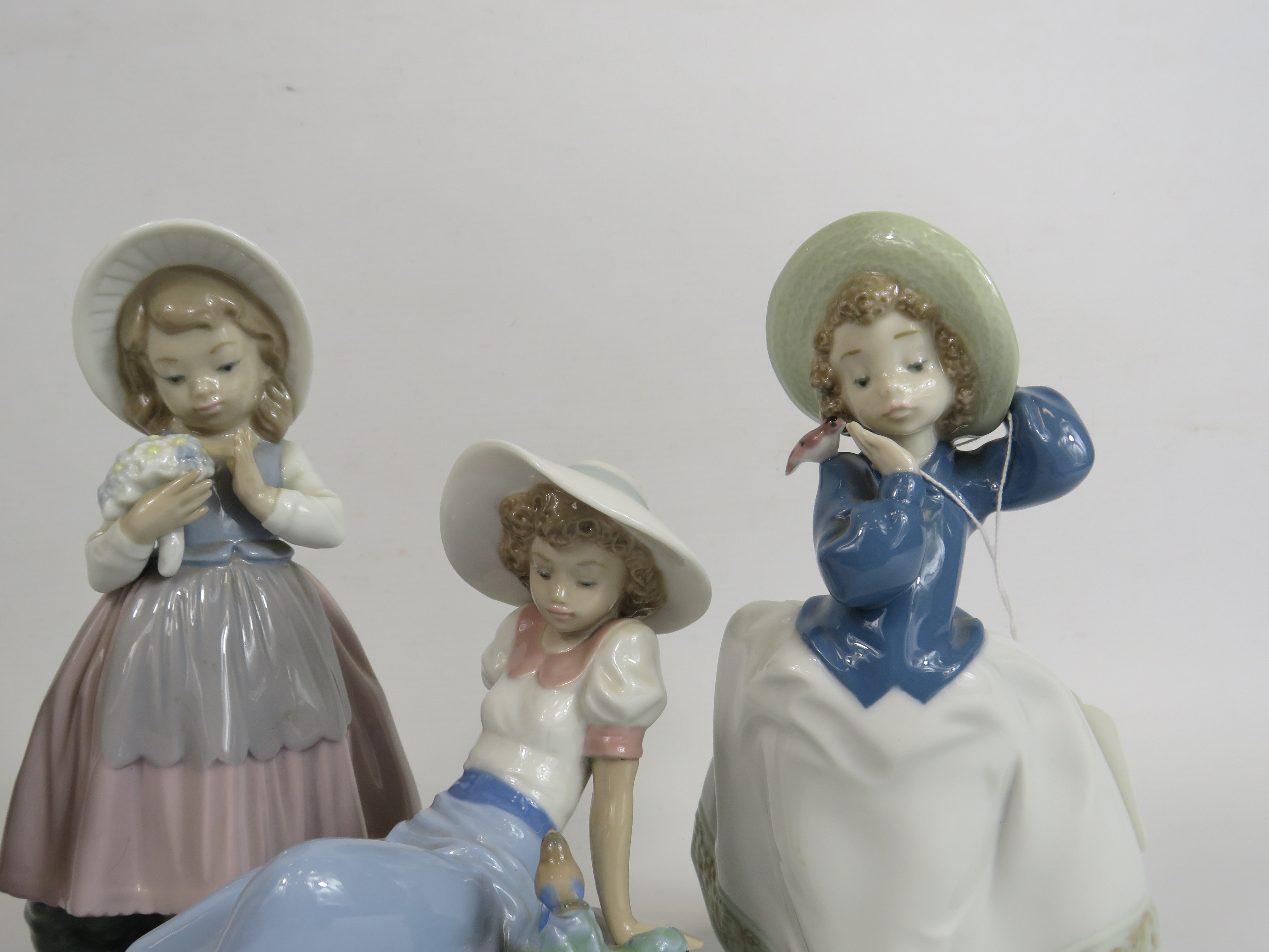 4 Nao figurines of girls with birds and flowers, the tallest stands 21cm. (one is missing a hand see - Image 3 of 5