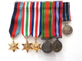 Bar of Miniature WW2 Medals. Defence, 39/45, France & Germany, Italy & 39/45 Star together with a Na