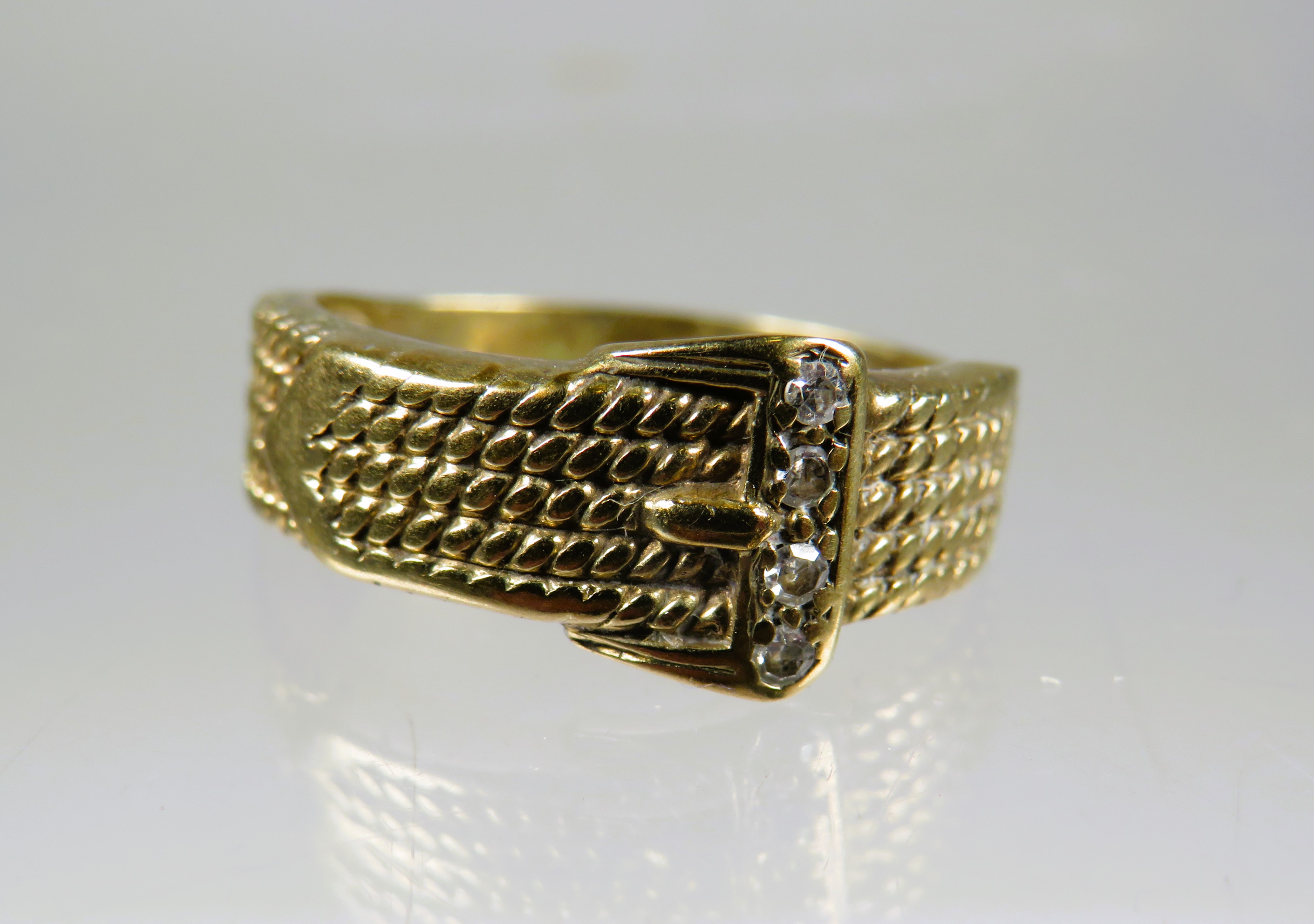 9ct Yellow Gold Buckle Ring set with Diamond chips to the Buckle.  Finger size K-5 to L      2.7g