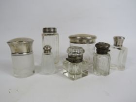 Selection of mainly Sterling silver topped bottles and pots etc.