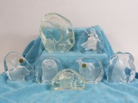 Five crystal d arcs glass paperweight with etched animal designs plus two others.