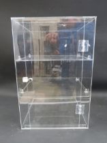 Perspex locking table top cabinet with 3 shelves, 19 1/4" tall, 12 3/4" wide and 12" deep.