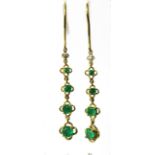 Pair of 9ct Yellow Gold drop earrings set with Graduated Emeralds.  55mm long.  See photos. 