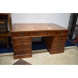 Large and deep pedestal desk . Wear to leather top. Four drawers to each side.   Measures  H:60 x W: