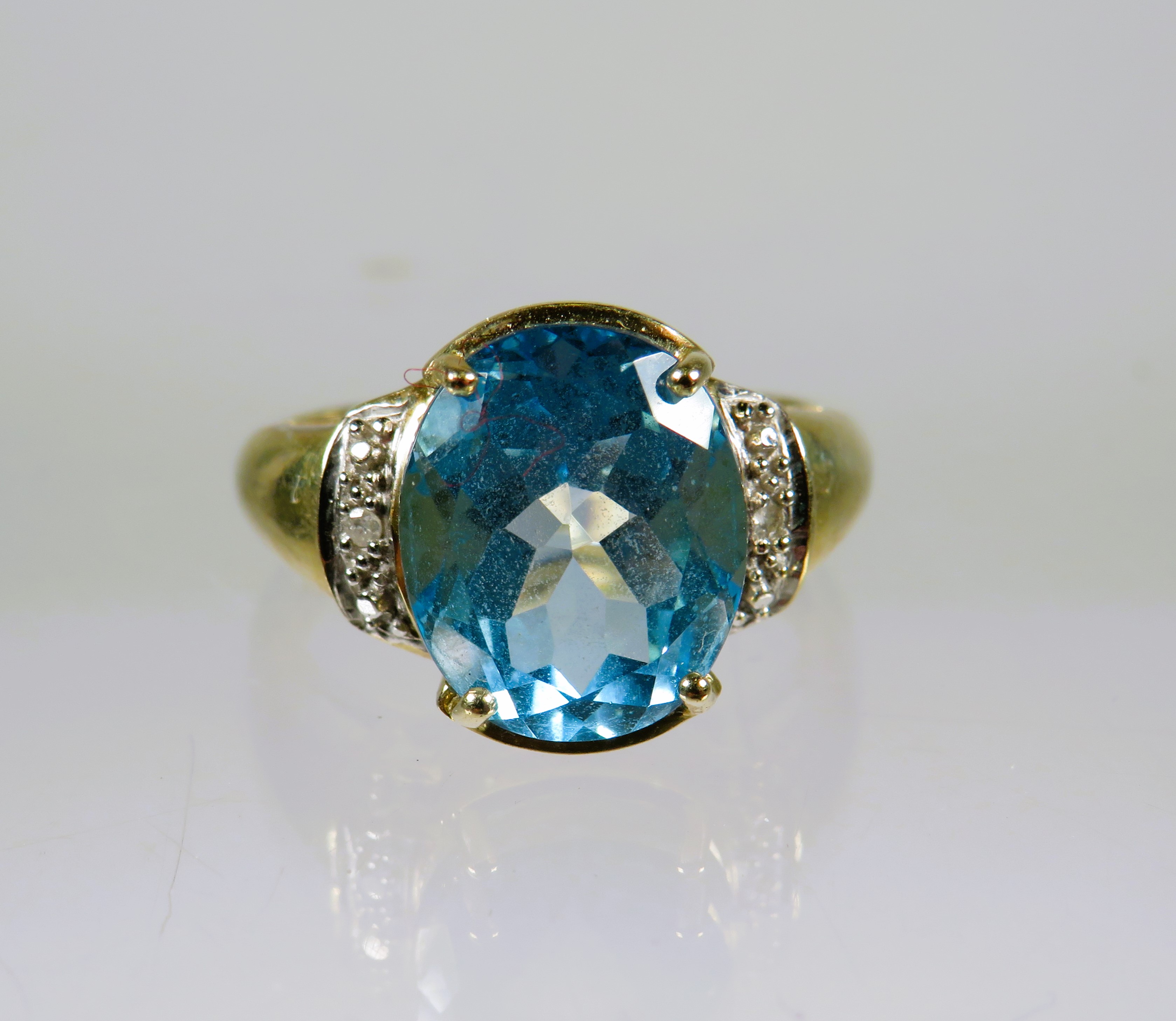 9ct Yellow Gold Ring set with a lovely large Topaz which measures 12 x 8 mm with melee Diamonds to t - Image 3 of 3