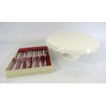 Cream Scaloped edged cake plates and a set of 6 cake forks.