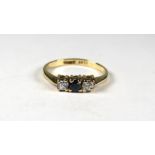 9ct Yellow Gold ring set with a small Central Sapphire Flanked by CZ.  Finger size 'K'    1.3g