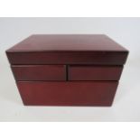 Wooden jewellery box with swing out level, 14cm tall, 22.5cm long and 14.5cm deep.