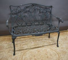 Cast metal garden bench, seat back height 36" , 47" from arm to arm & 18" wide.