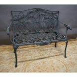 Cast metal garden bench, seat back height 36" , 47" from arm to arm & 18" wide.