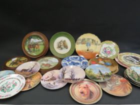 24 Various collectable plates including Royal Doulton, Wedgwood etc.