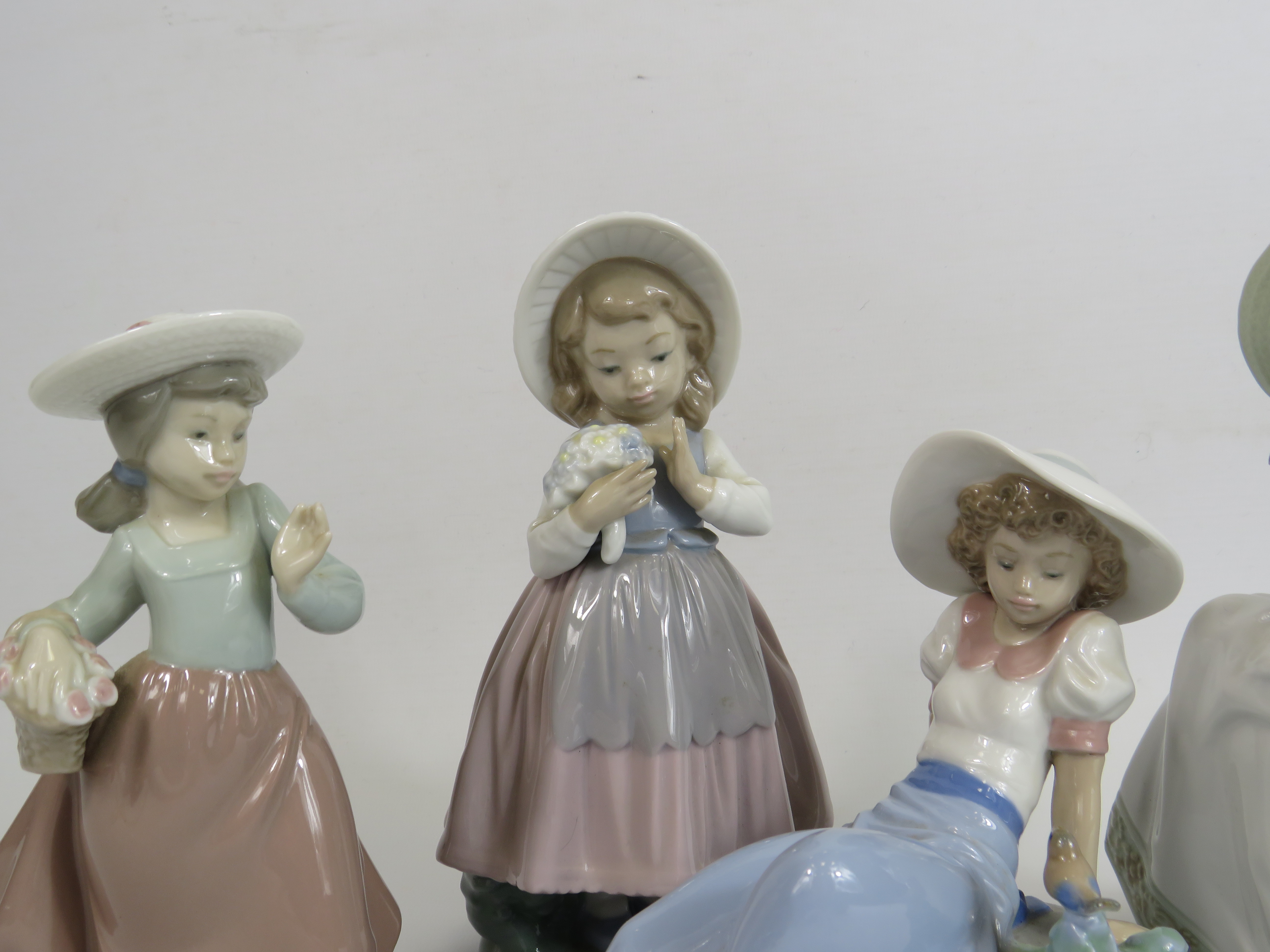 4 Nao figurines of girls with birds and flowers, the tallest stands 21cm. (one is missing a hand see - Image 2 of 5