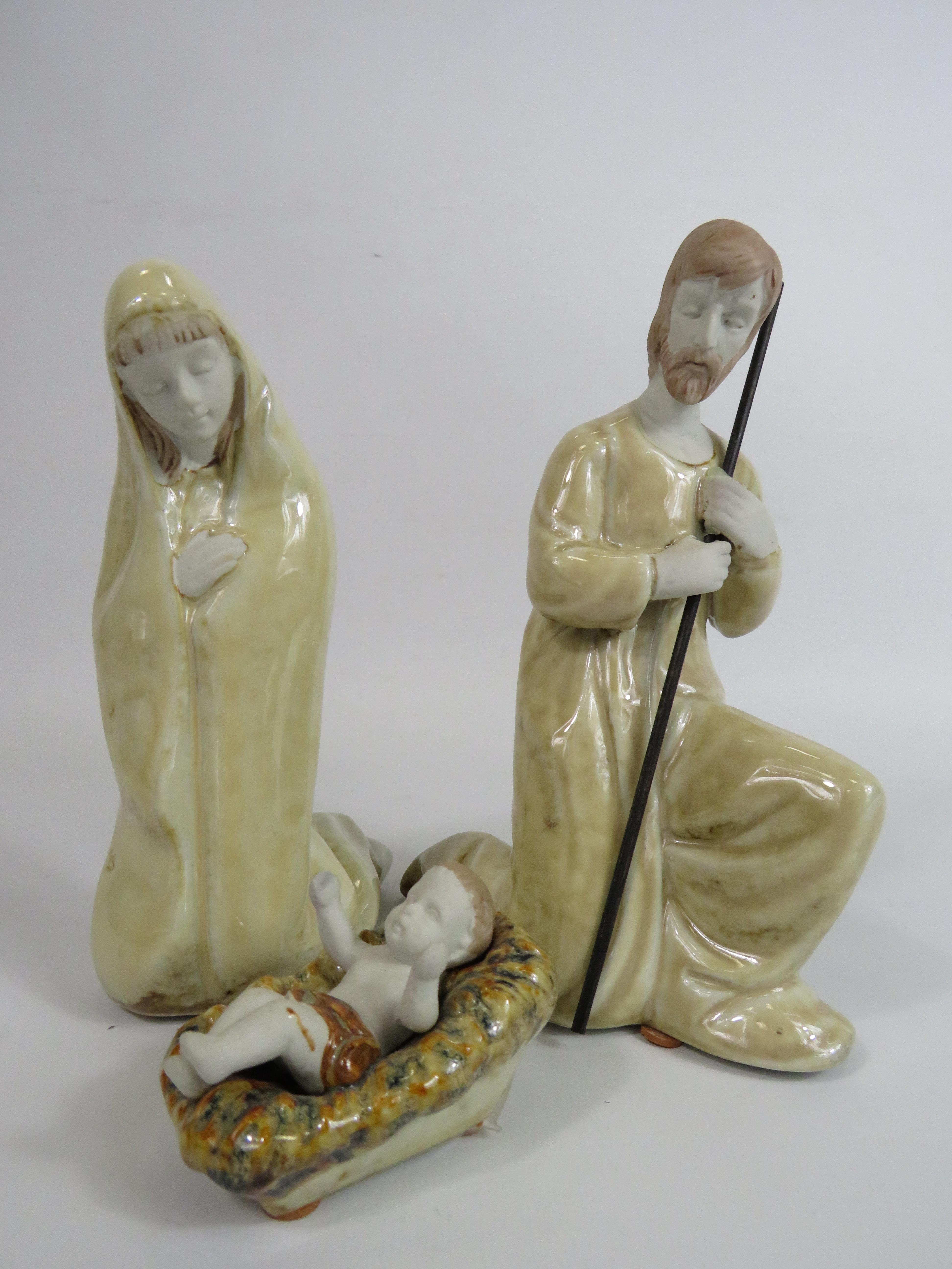 3 Ceramic figurines depiciting Joseph, Mary and Baby Jesus, the tallest stands 19.5cm.