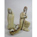 3 Ceramic figurines depiciting Joseph, Mary and Baby Jesus, the tallest stands 19.5cm.