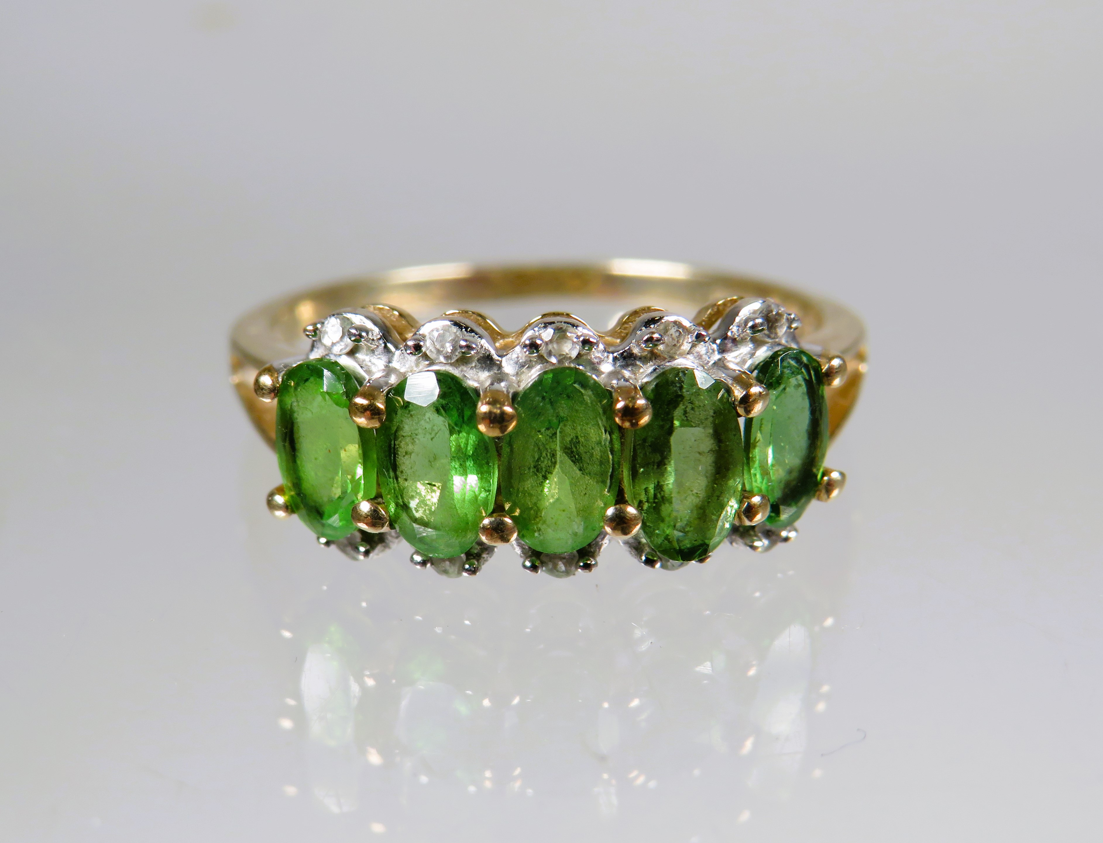 9ct Yellow Gold Ring set with a cluster of Green and Clear CZ gemstones.. Finger size 'M-5'   1.8g