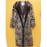 Ladies Long Fur dress coat by Chamonix in Faux Squirrel Made from 100% Modacry and polyester lining.