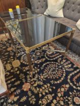 French Maison Jansen Style antiqued brass with smoked glass top table mounted on fluted legs with