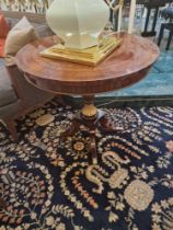 Mahogany cross banded circular dining table with ebony stringing the shallow apron above collared