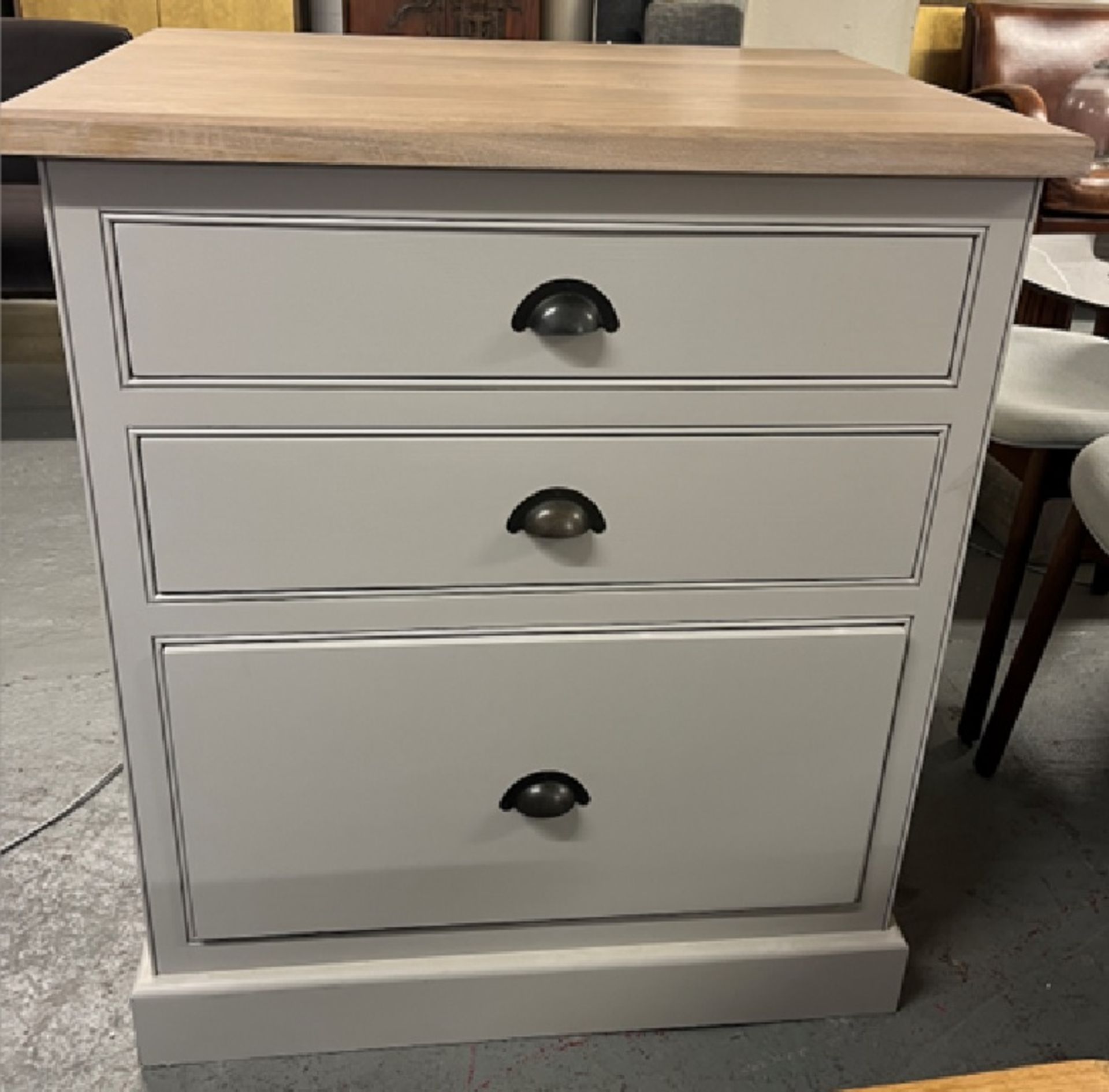 Cabinet With its oak top, this free standing kitchen storage unit features 3 useful drawers, a large