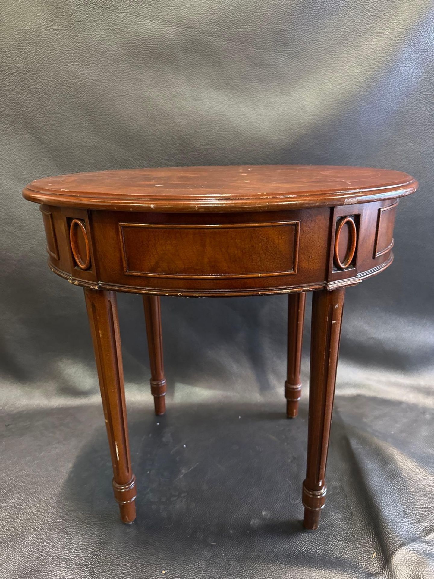 A Mahogany Ovoid Side Table The Freize Carved With Panels And Medallions Raised On Turned Fluted - Image 5 of 5