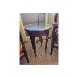 Circular Side Table With Antiqued Plate Top And Brass Trim Mounted On Tapering Legs With Brass