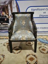 A Ebonised Fauteuil In French Empire Style. The Moulded Curved Toprails Above Padded And Scooped