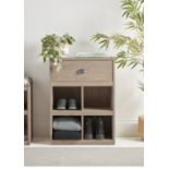 Featuring four shoe cubbies and drawers made from solid Scandinavian pine, this Shoe Cabinet will