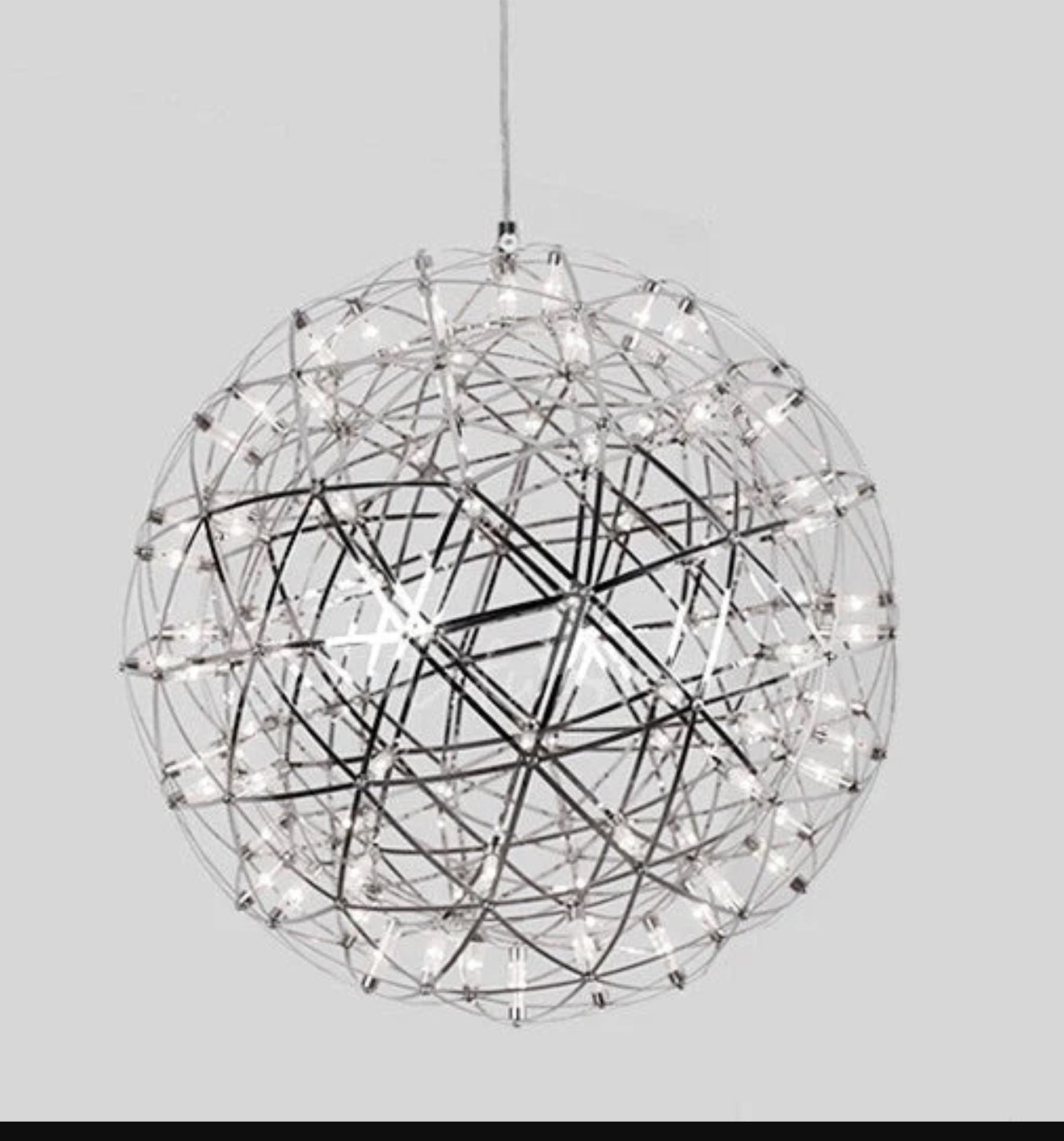 I-Lite chrome spherical globe striking silver starburst light pendant is inspired by elements of the
