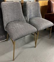 A set of contemporary dining chairs with gold finish effect legs and linen upholstery will add a