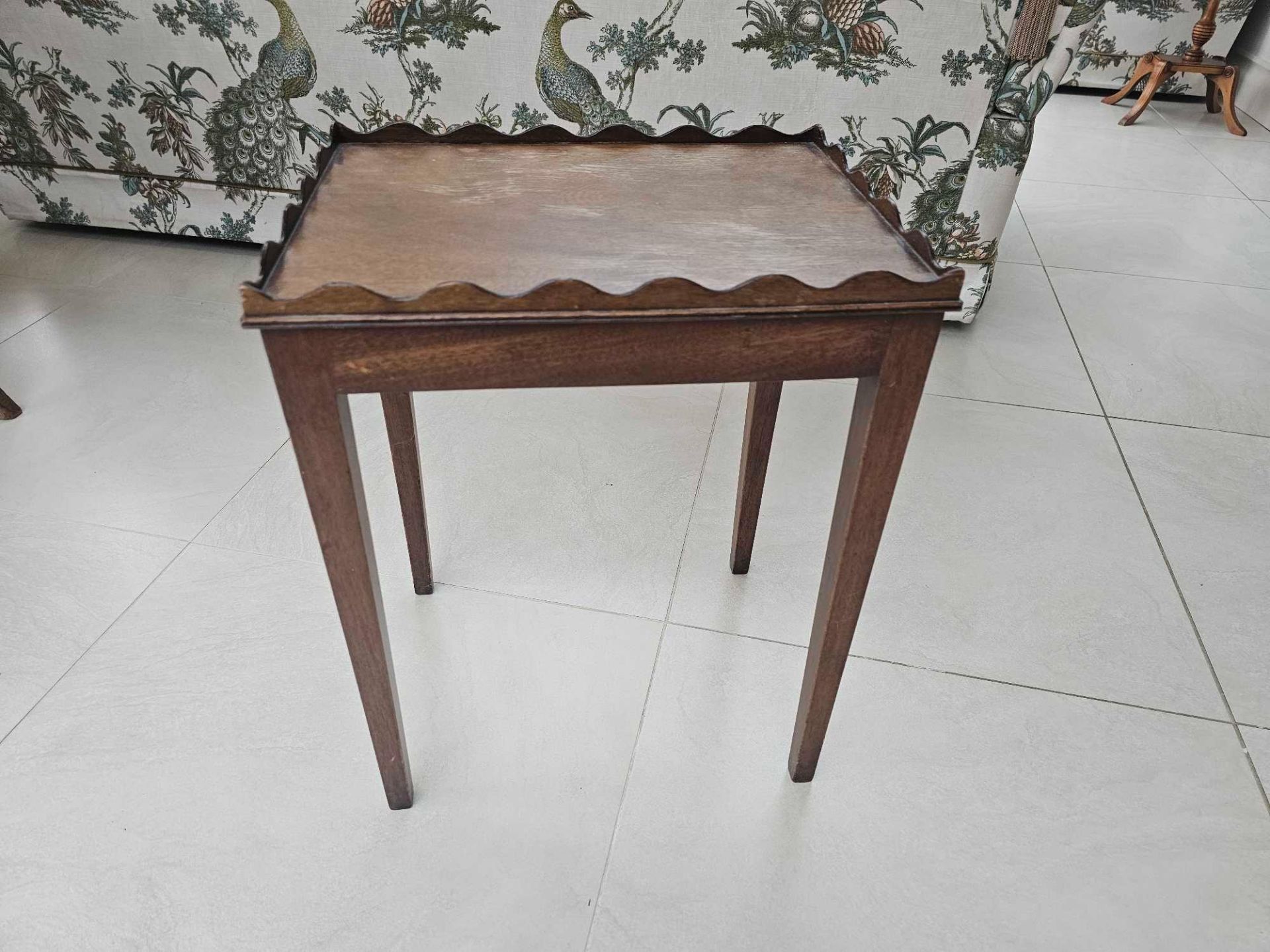 A Scalloped Edge Side Table Raised On Square Tapering Legs 42 X 32 X 52cm