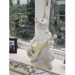 A Continental Porcelain Figurine Of A Cat Playing A Mandolin 48cm High