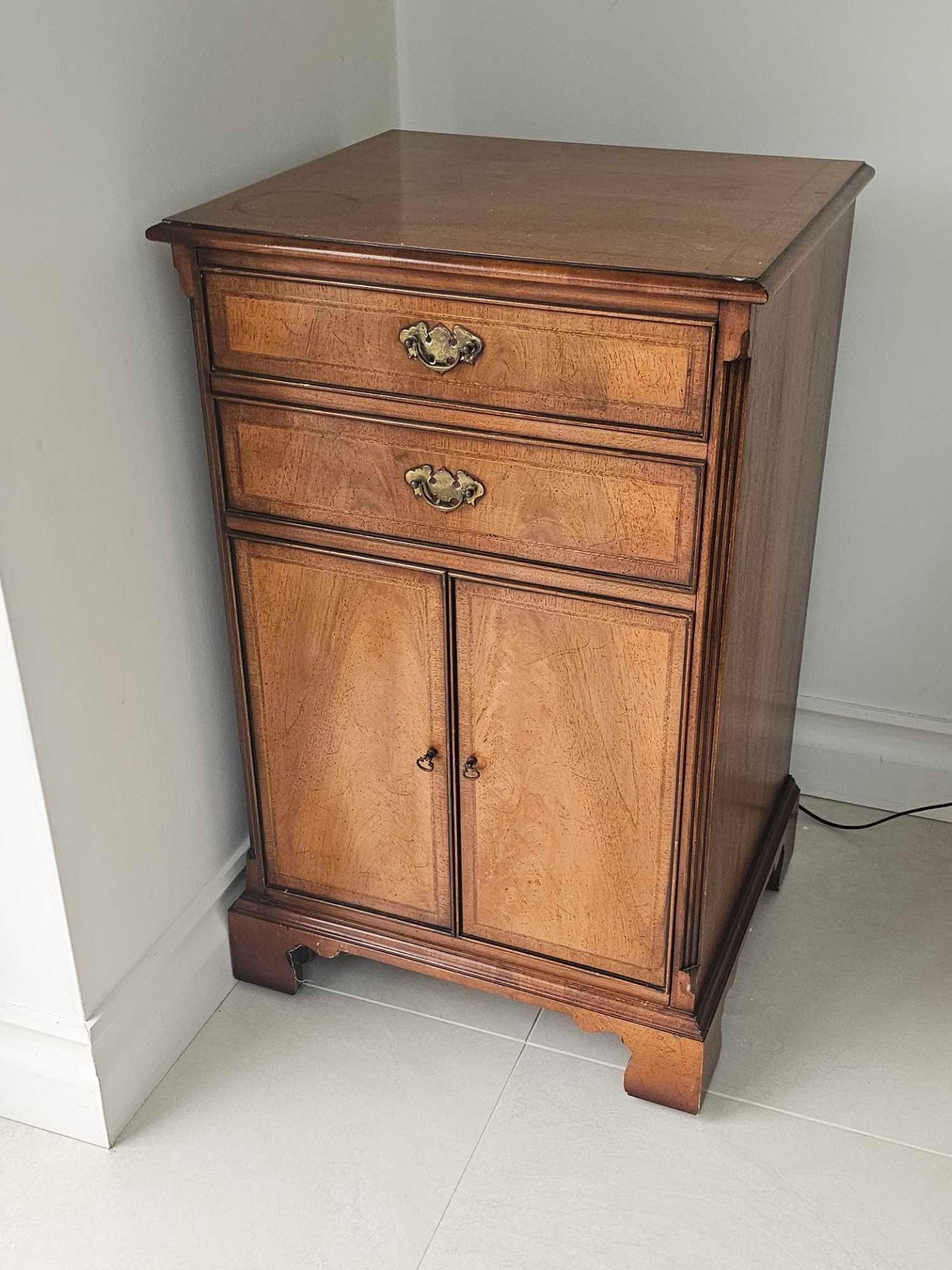 A Walnut Storage Cabinet With Simulated Drawer Front Panel Opens To Reveal 3 X Vertical Fitted
