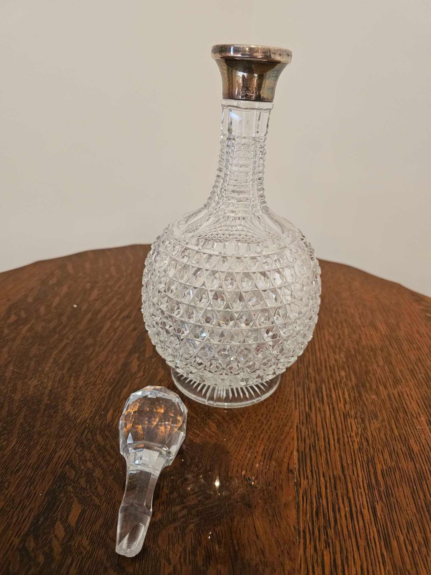 A Glass Cut Decanter With Stopper Of Bottle Form With Silver Assay Marked Collar London 1973 32cm - Image 10 of 10