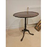 Chippendale Style Mahogany Tilt Top Table A Shaped Pie Crust Edge And Sits On A Well Turned Baluster
