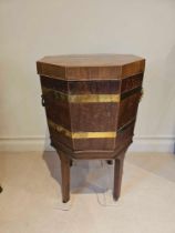 A George III Mahogany Octagonal Brass Bound Wine Cooler On Its Original Stand With Hinged Top The