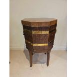 A George III Mahogany Octagonal Brass Bound Wine Cooler On Its Original Stand With Hinged Top The
