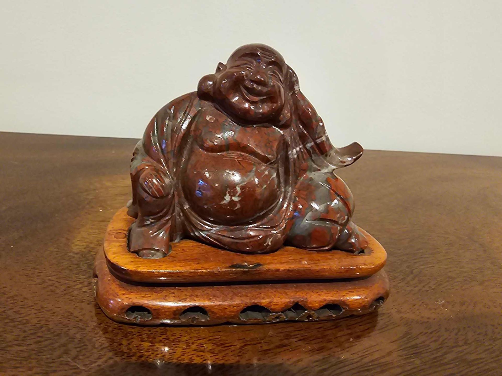 A Chinese Carved Soapstone Figure Of Hotei Seated On Rosewood Plinth 10cm Overall