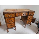 A George II Style Walnut Kneehole Desk The Leather Inlay Shaped Top Over A Frieze Drawer And Twin