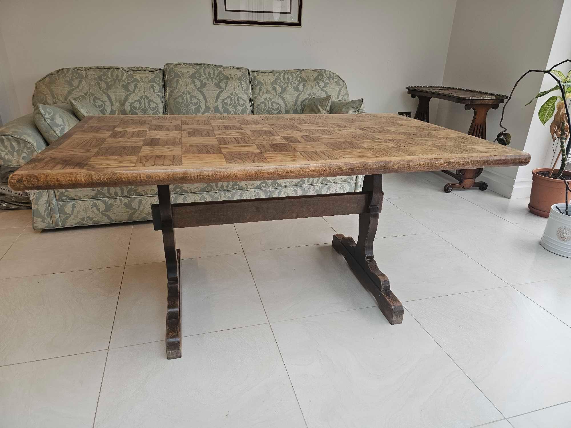 An Oak Trestle Dining Table With Parquetry Lattice Top 150 X 92 X 74cm