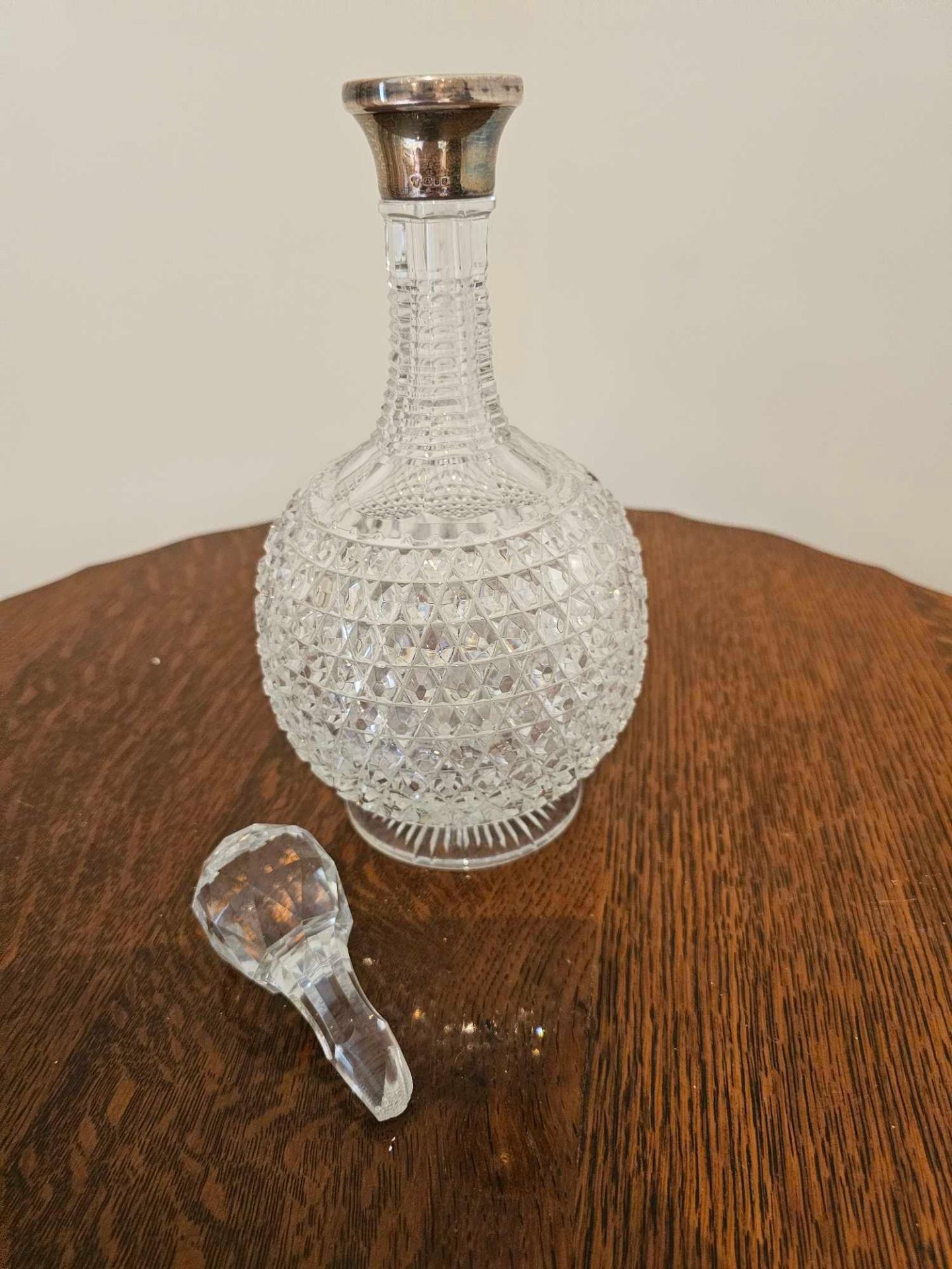 A Glass Cut Decanter With Stopper Of Bottle Form With Silver Assay Marked Collar London 1973 32cm - Image 6 of 10