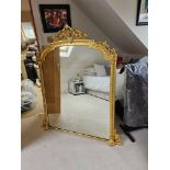 A Period Giltwood Overmantel Mirror The Arch Topped Rectangular Frame With Foliate Strapwork A